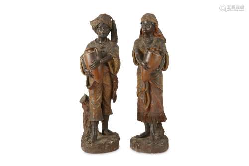 A PAIR OF LATE 19TH POLYCHROME PLASTER FIGURES OF A NORTH AFRICAN WATER CARRIERS in the style of