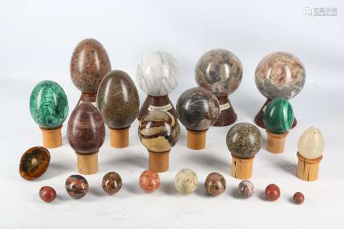 A COLLECTION OF TWENTY TWO VARIOUS HARDSTONE EGGS AND SPHERES including two large malachite eggs,