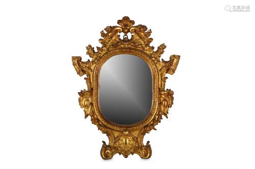 AN 18TH CENTURY GILTWOOD AND GESSO WALL MIRROR the frame of oval form with Rococo ornamentation, the