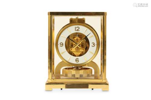 A 1970'S JAEGER LE COULTRE LACQUERED BRASS ATMOS CLOCK NO. 433357 of typical form, the canted case