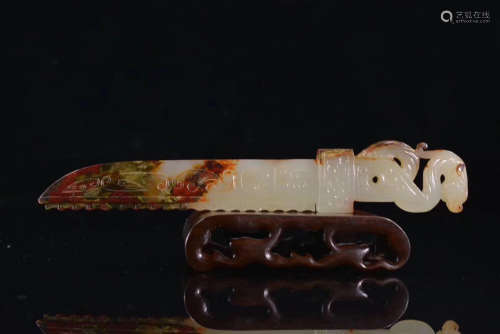 A HETIAN JADE CARVED SWORD ORNAMENT