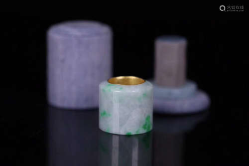 AN OLD JADEITE CARVED THUMB RING