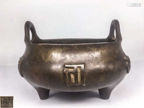 A BRONZE MOLDED TRIPOD CENSER