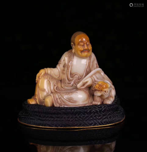 A SOAPSTONE CARVED LUOHAN FIGURE