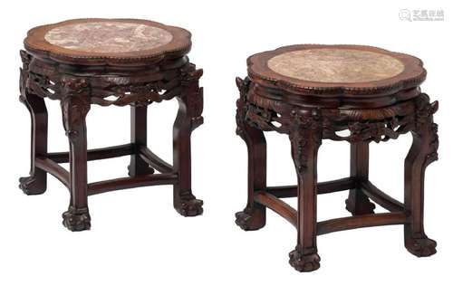 A pair of Chinese carved hardwood stools with marble