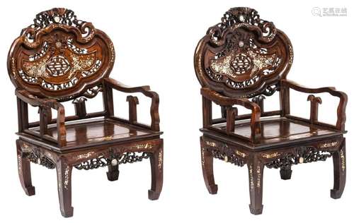 A pair of Chinese carved exotic hardwood armchairs with