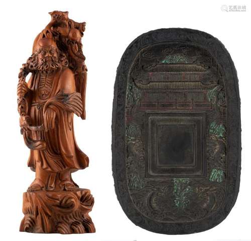 A Chinese carved wooden figure, depicting an Immortal;