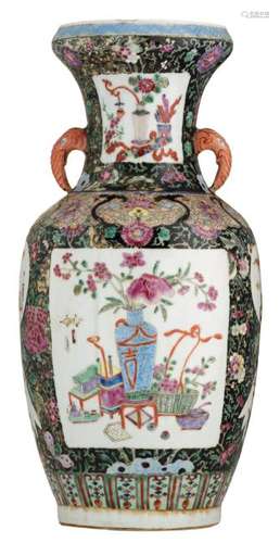 A Chinese famille noir floral decorated vase, the