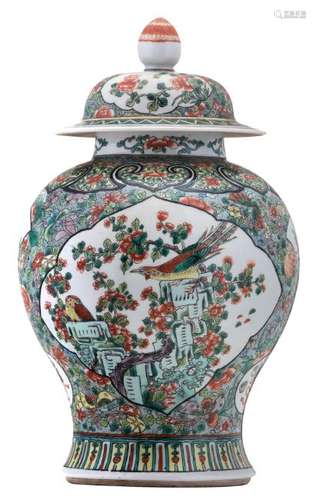 A Chinese famille verte floral decorated vase and