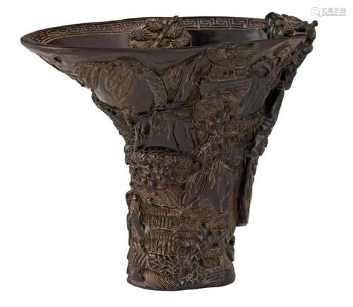 A Chinese relief moulded resin libation cup, decorated