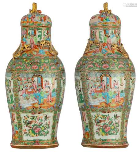 A pair of Chinese famille rose Canton vases and covers,