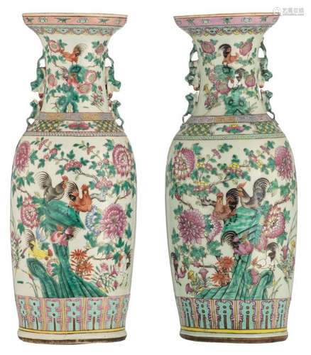 A near pair of Chinese famille rose vases, decorated