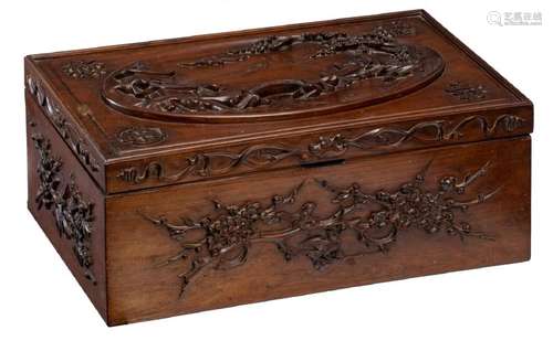 An Oriental alto relievo floral decorated hardwood