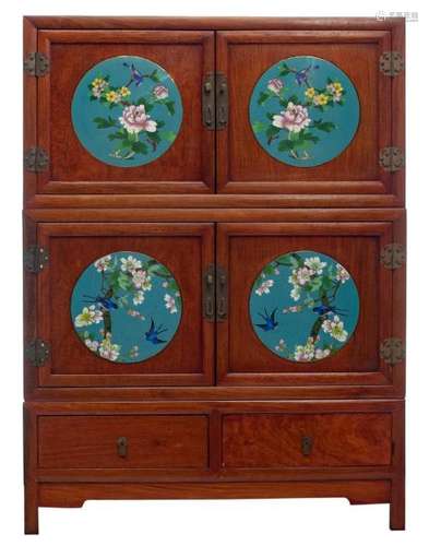 A Chinese wooden cabinet with brass mounts, the doors