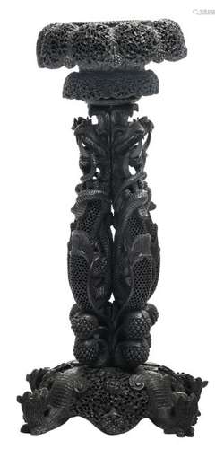 An Anglo-Indian richly carved ebonized exotic hardwood