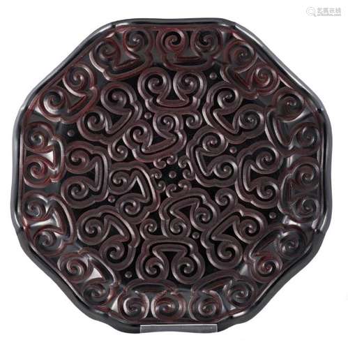 A Chinese octagonal black and cinnabar lacquer dish,