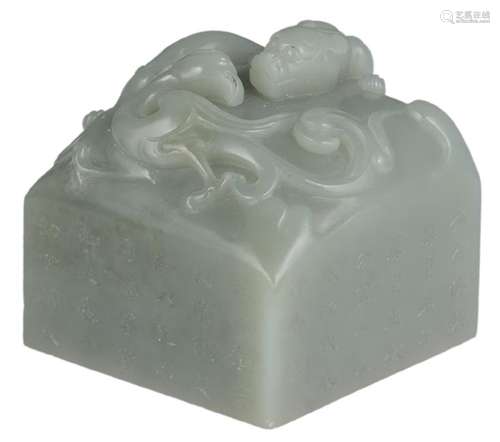 A Chinese carved jade seal mark, decorated with a