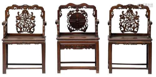 A pair of Chinese carved hardwood armchairs, the back