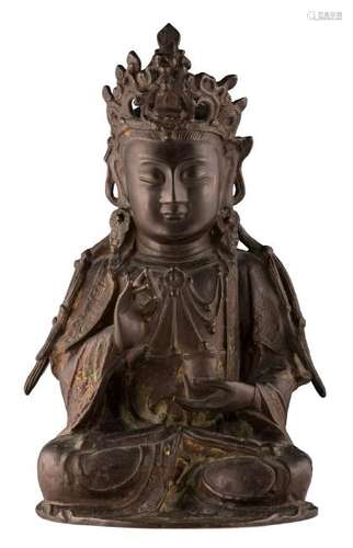 A Chinese Ming style patinated bronze seated Buddha, H