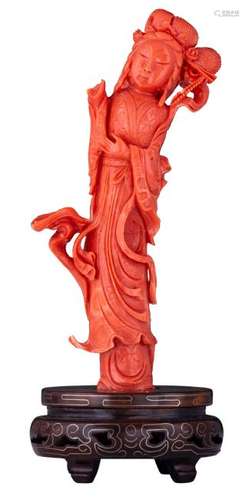 A Chinese carved red coral figure, depicting a court