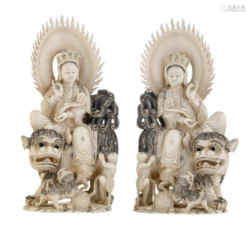 A pair of Chinese engraved and coloured ivory