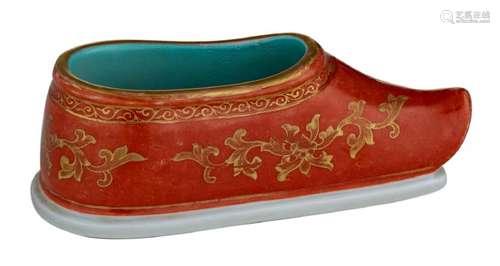 A Chinese iron red and gilt decorated shoe, the sole