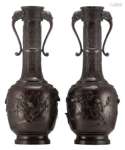 A pair of Chinese relief decorated patinated bronze