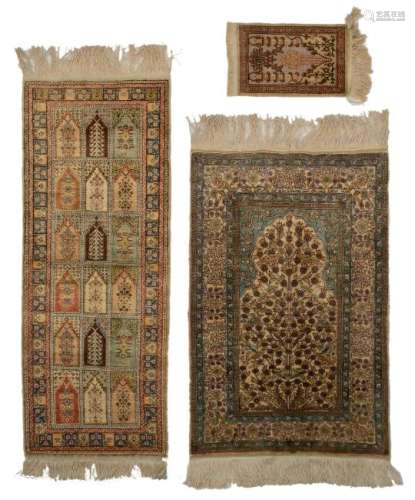 Two Oriental silk carpets, 43 x 112 - 59 x 87 cm; added
