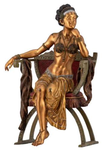 Cezaro, a serail beauty seated in a folding chair, H 46