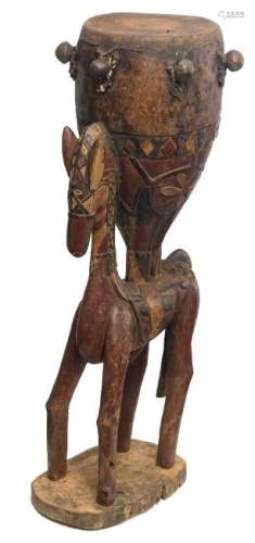 A wood and polychrome Baga drum on a horse shaped base,