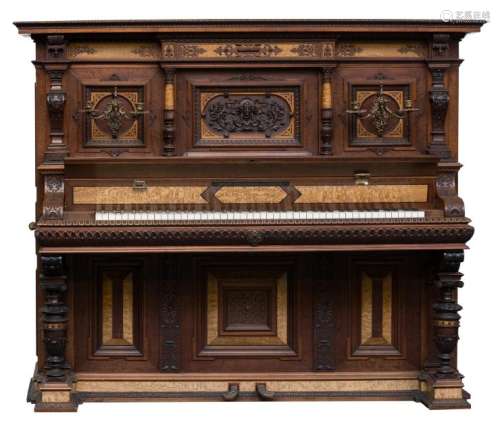 A fine richely carved walnut upright concert piano,