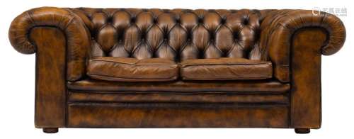 A two seat brown leather upholsterd Chesterfield sofa,