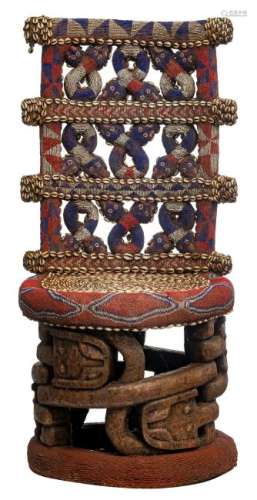 A carved wooden chair of the Bamum, with thousands of