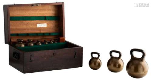 A walnut box containing a complete set of official