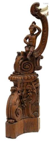 A sculpted oak, figural newel post, decorated with