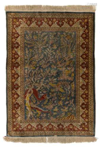 A fine Oriental silk rug, the field decorated with a