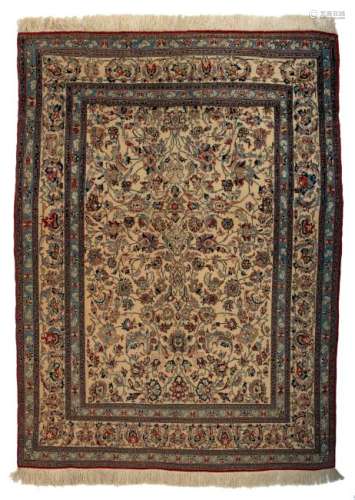 An Oriental carpet, decorated with stylised floral
