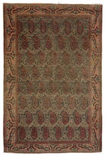 An Oriental rug, decorated with stylised floral Boteh