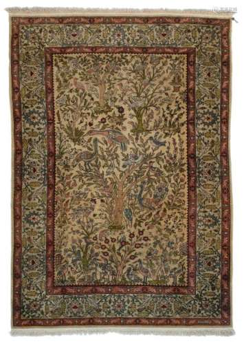 An Oriental 'tree of life' carpet, decorated with birds