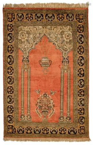 An Oriental carpet, decorated with geometric and