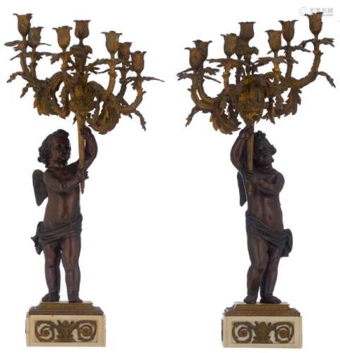 A pair of Belle Epoque candelabras, patinated and gilt