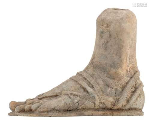 An ancient soft fired terracotta votive left foot