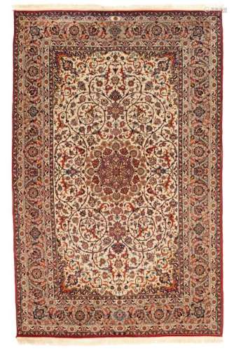 A fine Oriental rug, decorated with floral motifs and a