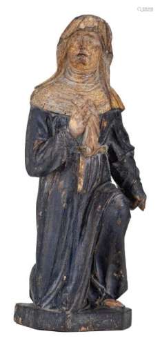 A religious wooden sculpture with polychrome paint and