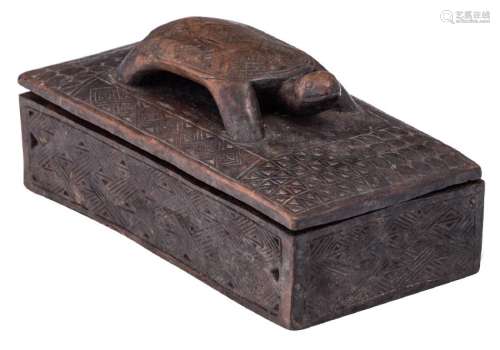 An etnographic African solid wooden box sculpted on top