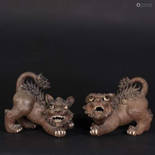 A PAIR OF SHIWAN POTTERY LIONS