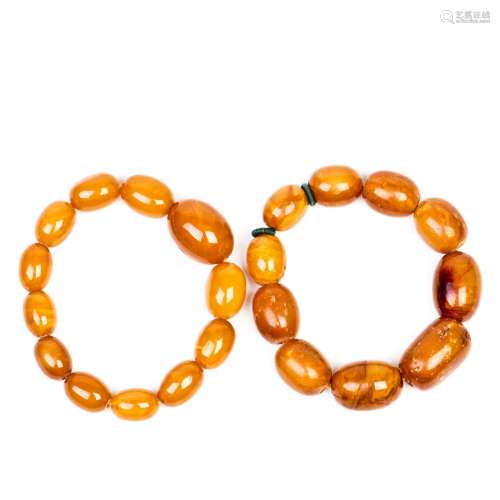 TWO STRANDS OF SMALL BEADED BEESWAX BRACELETS