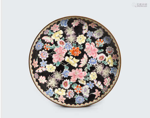 Qianlong mark, late Qing/Republic Period A black-ground  enameled metal dish with mille-fleurs decoration