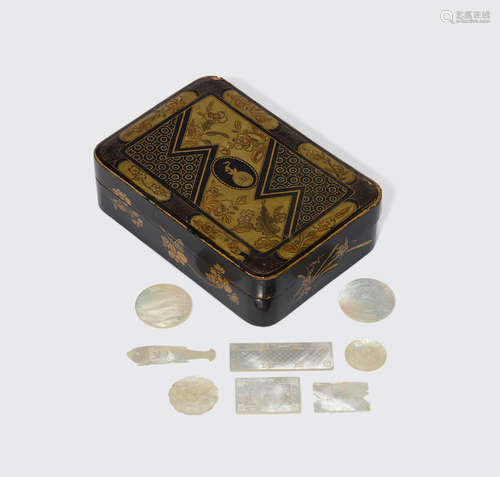 Late Qing/Republic period A set of mother-of-pearl game pieces in a lacquered box