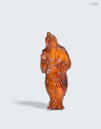 A carved amber female figure